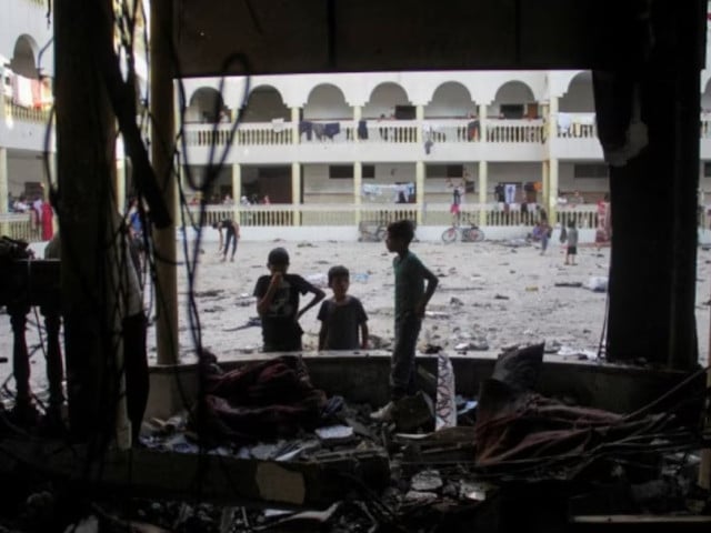 palestinians look at the damage at the site of an israeli strike on a school sheltering displaced people amid the israel hamas conflict in gaza city august 10 2024 photo reuters